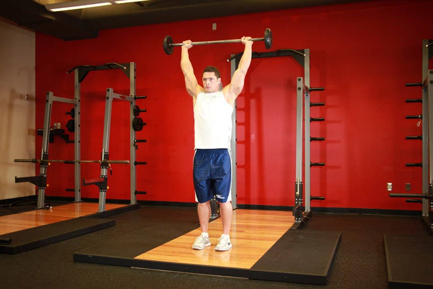 Standing Barbell Press Behind Neck, position 2 of 2