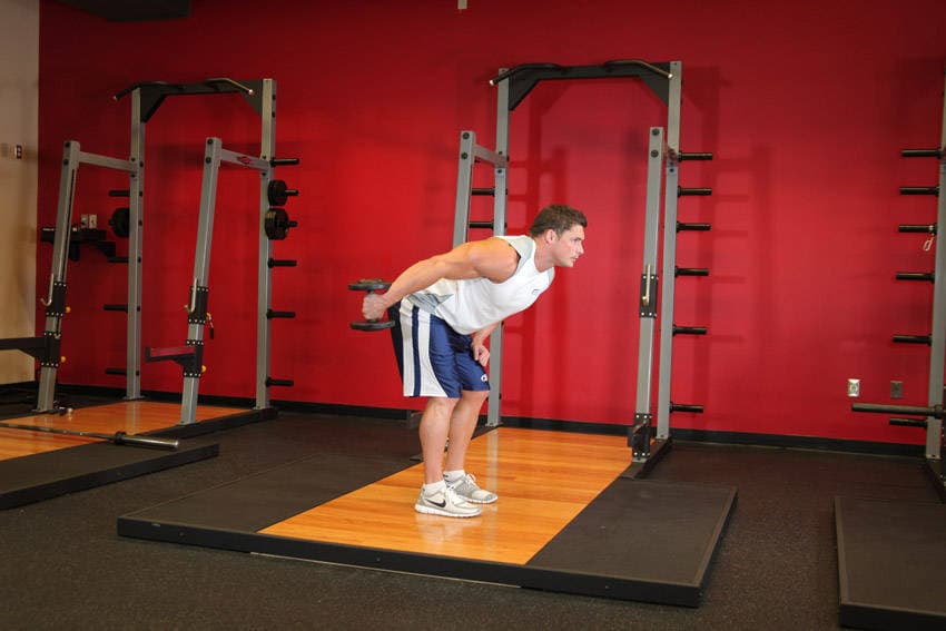 Standing Bent-Over One-Arm Dumbbell Triceps Extension, position 2 of 2