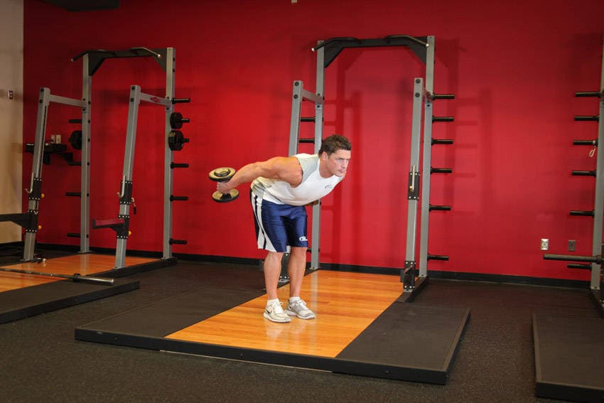 Standing Bent-Over Two-Arm Dumbbell Triceps Extension, position 2 of 2
