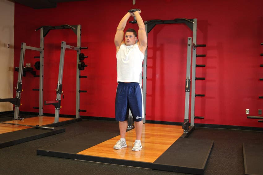 Standing Dumbbell Triceps Extension, position 1 of 2
