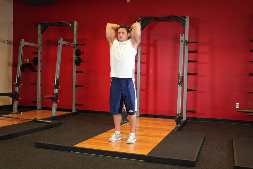 Standing Dumbbell Triceps Extension, position 2 of 2