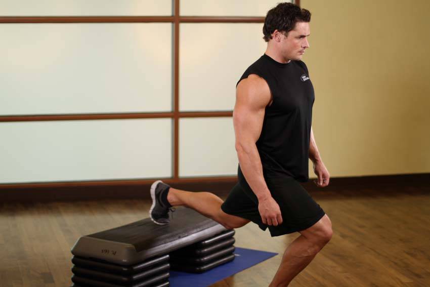 Standing Elevated Quad Stretch, position 1 of 2