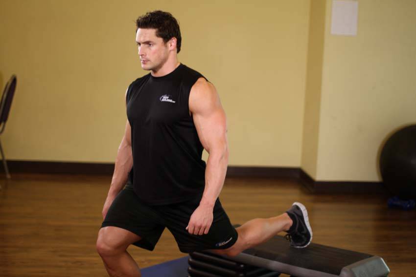 Standing Elevated Quad Stretch, position 2 of 2