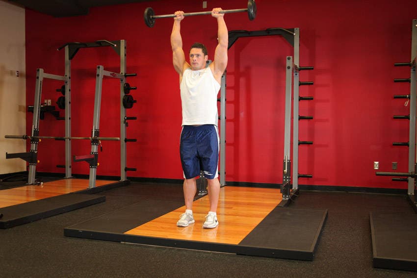 Standing Front Barbell Raise Over Head, position 2 of 2