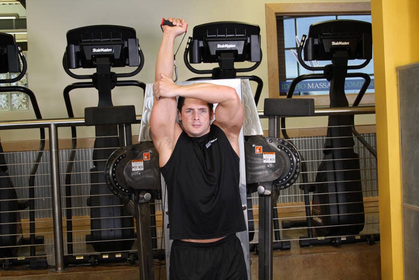 Standing Low-Pulley One-Arm Triceps Extension, position 2 of 2