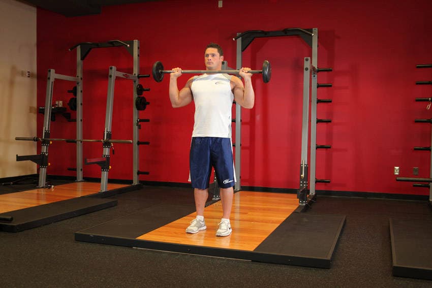 Standing Military Press, position 1 of 2