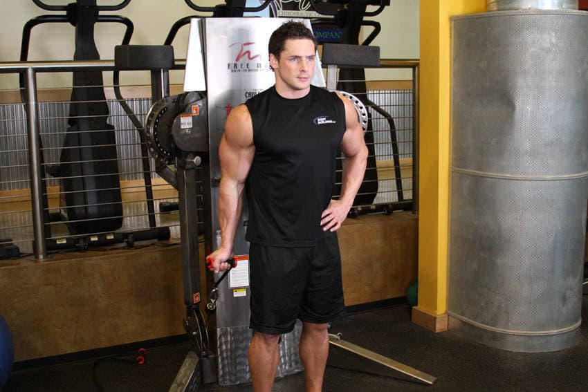 Standing One-Arm Cable Curl, position 1 of 2