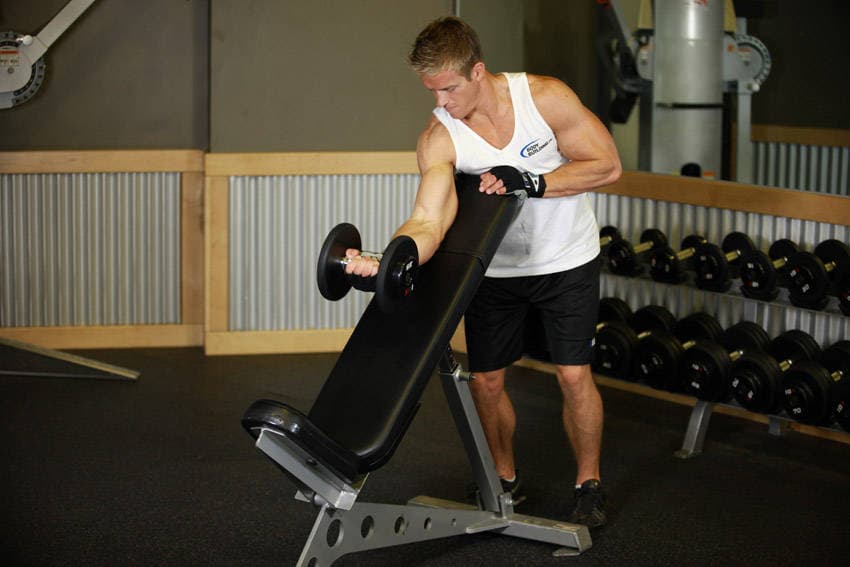 Standing One-Arm Dumbbell Curl Over Incline Bench, position 1 of 2