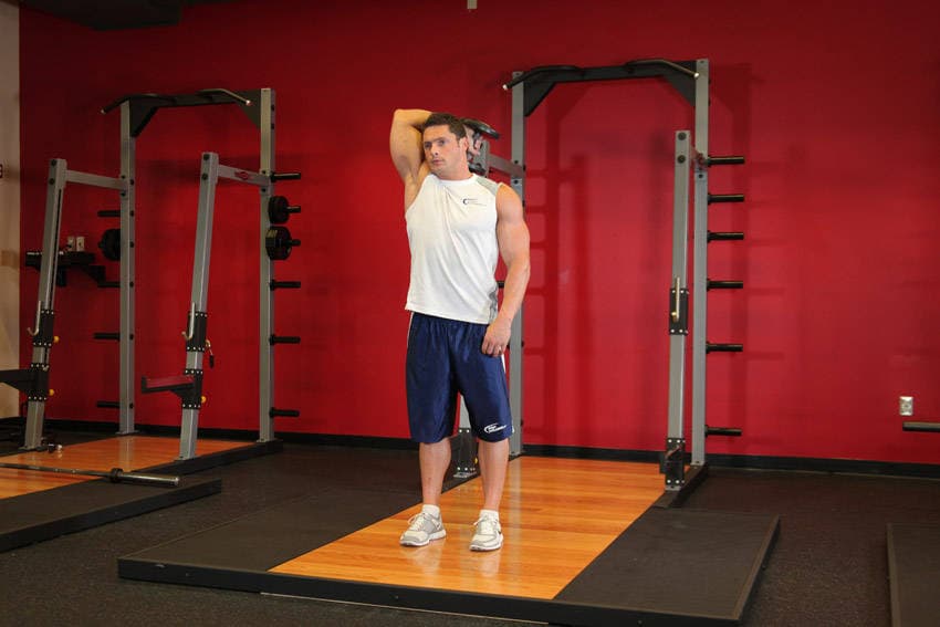 Standing One-Arm Dumbbell Triceps Extension, position 2 of 2