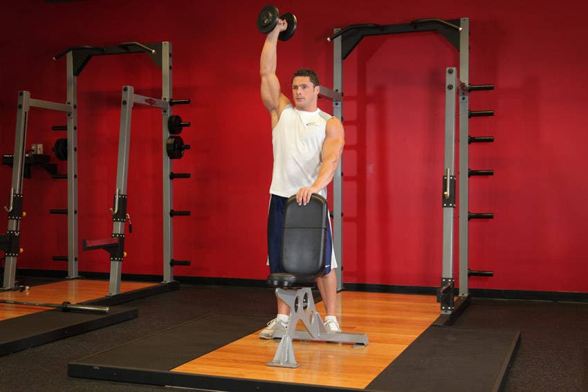 Standing Palm-In One-Arm Dumbbell Press, position 2 of 2