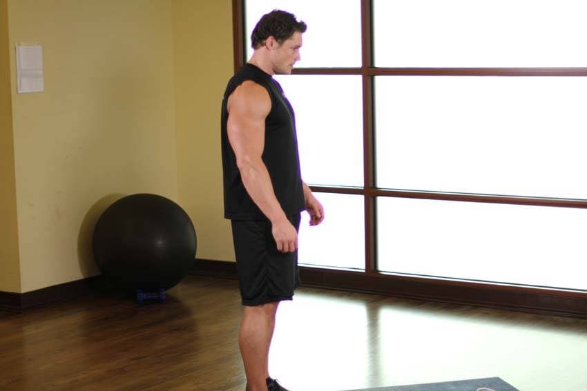Standing Toe Touches, position 1 of 2