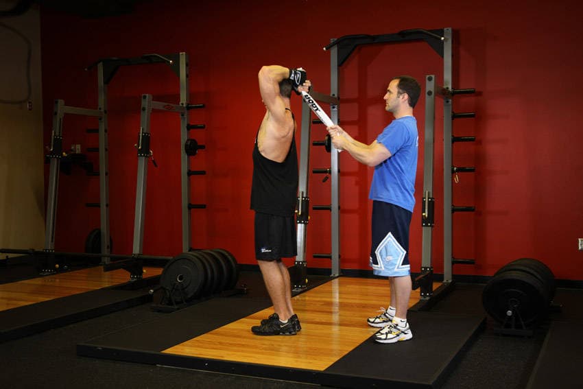 Standing Towel Triceps Extension, position 1 of 2