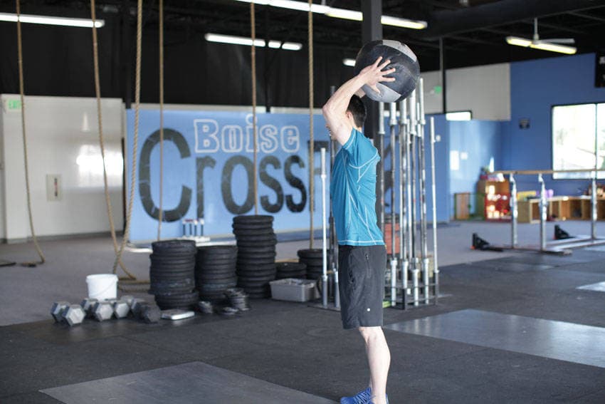 Standing Two-Arm Overhead Throw, position 2 of 2