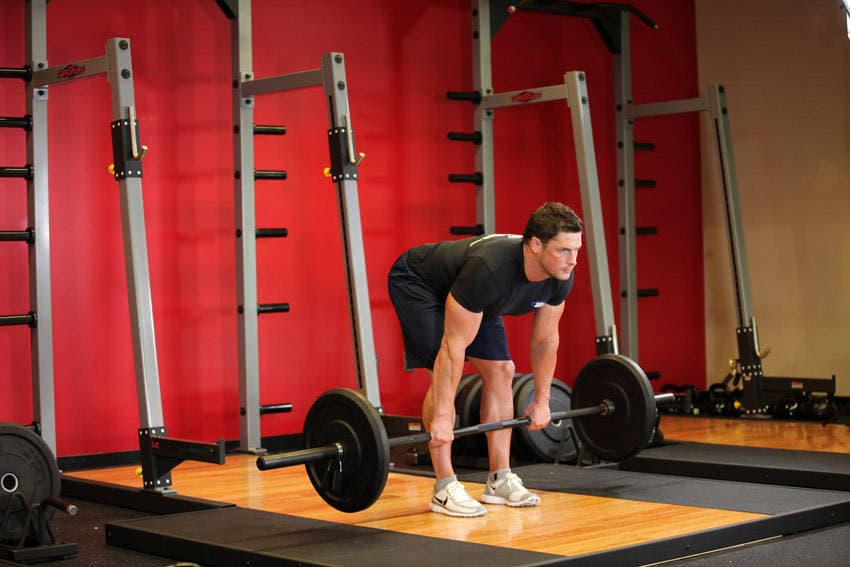 Stiff-Legged Barbell Deadlift, position 1 of 2