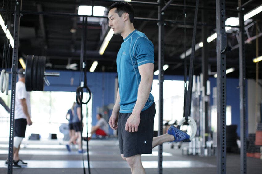 Suspended Split Squat, position 1 of 2
