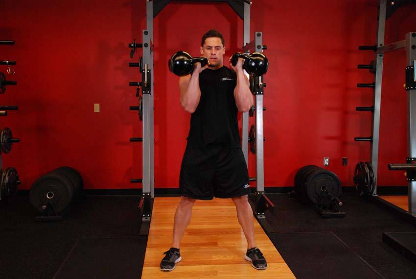 Two-Arm Kettlebell Clean, position 2 of 2