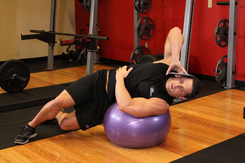 Weighted Ball Side Bend, position 1 of 2