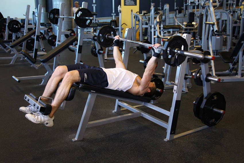 Wide-Grip Decline Barbell Bench Press, position 1 of 2