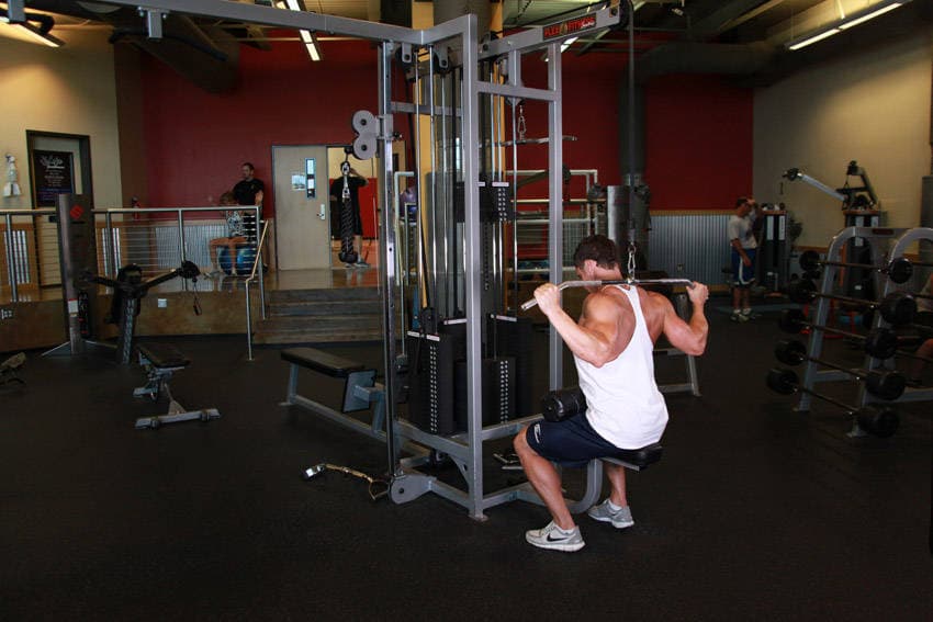Wide-Grip Pulldown Behind The Neck, position 1 of 2