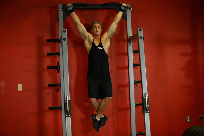 Wide-Grip Rear Pull-Up, position 1 of 2