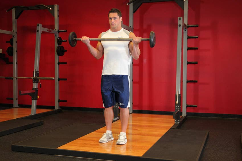 Wide-Grip Standing Barbell Curl, position 2 of 2