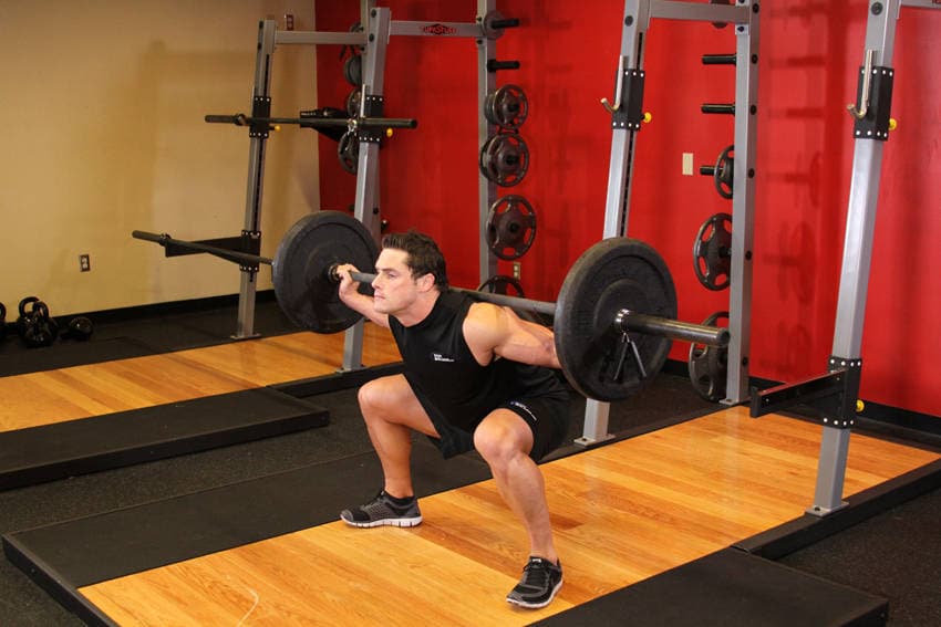 Wide Stance Barbell Squat, position 2 of 2